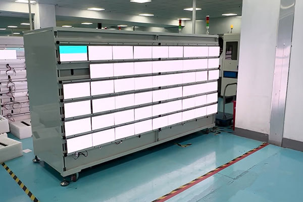 LED display modules undergoing illumination and aging tests